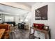 Inviting living room with dark floors, grey sofas, and a white staircase leading to the upper level at 1537 S Owens St # 31, Denver, CO 80232