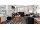 Inviting living room with a fireplace, wood-look floors, and cozy seating arrangement at 1537 S Owens St # 31, Denver, CO 80232
