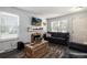 Cozy living room with fireplace, wall-mounted TV, and modern decor at 1537 S Owens St # 31, Denver, CO 80232