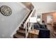 Staircase leading to upper level, with view of the comfortable living room at 1537 S Owens St # 31, Denver, CO 80232
