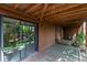 Covered back porch with a sliding glass door and wood ceiling at 262 Yank Ct, Lakewood, CO 80228