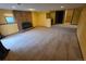 Spacious basement featuring neutral carpet, brick fireplace, and recessed lighting at 262 Yank Ct, Lakewood, CO 80228