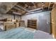 Unfinished basement with exposed ceiling, carpeting and storage space at 262 Yank Ct, Lakewood, CO 80228