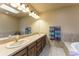 Large bathroom vanity with double sinks and a soaking tub at 262 Yank Ct, Lakewood, CO 80228
