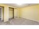 Bedroom with neutral walls, carpeted floors and closet with mirrored doors at 262 Yank Ct, Lakewood, CO 80228