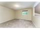 Bedroom with neutral carpeting and a window bringing in natural light at 262 Yank Ct, Lakewood, CO 80228
