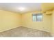 Cozy bedroom featuring neutral walls, carpeted floors and a window with blinds at 262 Yank Ct, Lakewood, CO 80228