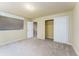 Bedroom with neutral colored walls and carpet at 262 Yank Ct, Lakewood, CO 80228