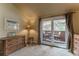 Bedroom has a private balcony with sliding glass doors and furniture at 262 Yank Ct, Lakewood, CO 80228