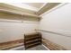 Walk-in closet features metal rods and wood laminate lower trim with carpeted flooring at 262 Yank Ct, Lakewood, CO 80228