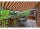 Back deck with outdoor furniture and retractable awning at 262 Yank Ct, Lakewood, CO 80228