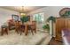 Cozy dining room featuring a wooden table set, large window, and elegant light fixture at 262 Yank Ct, Lakewood, CO 80228