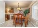 Dining room showing a wooden table with chairs and a view of the adjacent kitchen area at 262 Yank Ct, Lakewood, CO 80228