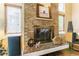 Close-up of a brick fireplace, showcasing its details and hearth at 262 Yank Ct, Lakewood, CO 80228