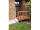 Charming entryway with a raised wooden deck, brick accents, and a welcoming front door at 262 Yank Ct, Lakewood, CO 80228