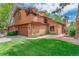 Beautiful exterior showcasing a two-story home with a balcony, lawn, and brick accents at 262 Yank Ct, Lakewood, CO 80228