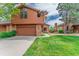 Charming two-story home with a well-manicured lawn, a balcony, and a two-car garage at 262 Yank Ct, Lakewood, CO 80228