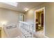 Hallway leading to bathroom offers a skylight for extra natural lighting at 262 Yank Ct, Lakewood, CO 80228