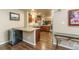 Spacious kitchen with breakfast bar and stainless steel appliances looking into dining room at 262 Yank Ct, Lakewood, CO 80228