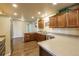 The kitchen features wood floors, cabinets, and stainless steel appliances at 262 Yank Ct, Lakewood, CO 80228