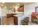 Open kitchen design with ample counter space, breakfast bar, and modern wood cabinets at 262 Yank Ct, Lakewood, CO 80228