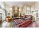 Warm living room showcasing a brick fireplace and comfortable seating area at 262 Yank Ct, Lakewood, CO 80228