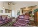 Inviting living room features hardwood floors, an open layout, and comfortable leather furniture set at 262 Yank Ct, Lakewood, CO 80228