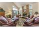 Comfortable living room with a brick fireplace and ample seating at 262 Yank Ct, Lakewood, CO 80228
