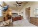 This main bedroom features a vaulted ceiling with fan and comfortable furnishings at 262 Yank Ct, Lakewood, CO 80228