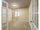 Bright office space with neutral carpet, french doors, and a large window at 262 Yank Ct, Lakewood, CO 80228