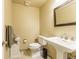 The powder room offers a pedestal sink, tile flooring and decorative accents at 262 Yank Ct, Lakewood, CO 80228