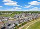 Aerial view of a new neighborhood development featuring homes with solar panels, and a walking path at 800 Meadowlark Dr, Erie, CO 80516