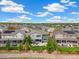 Aerial view of homes, showing a manicured backyard, a fence, and a hot tub at 800 Meadowlark Dr, Erie, CO 80516