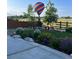 Landscaped backyard with seating area, garden, and a hot air balloon view at 800 Meadowlark Dr, Erie, CO 80516