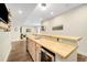 Stylish bar area with wood countertop, modern cabinets, and convenient beverage cooler at 800 Meadowlark Dr, Erie, CO 80516