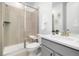 Modern bathroom features a glass shower, toilet and vanity with drawers at 800 Meadowlark Dr, Erie, CO 80516