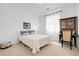 Cozy bedroom with light-colored walls, soft carpet, and comfortable bed at 800 Meadowlark Dr, Erie, CO 80516