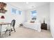 Well-lit bedroom with desk and neutral decor at 800 Meadowlark Dr, Erie, CO 80516