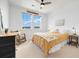 Bright bedroom features sunny windows, ceiling fan, and rocking chair at 800 Meadowlark Dr, Erie, CO 80516