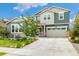 Charming two-story home featuring a well-manicured lawn and inviting curb appeal on a beautiful sunny day at 800 Meadowlark Dr, Erie, CO 80516