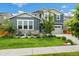 Charming home with well-kept lawn, landscaping, stone accents, and two-car garage at 800 Meadowlark Dr, Erie, CO 80516