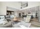 Open-concept living room seamlessly connects to the kitchen, creating a bright and inviting atmosphere at 800 Meadowlark Dr, Erie, CO 80516