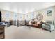 Spacious upstairs loft with plush carpeting and comfortable seating at 800 Meadowlark Dr, Erie, CO 80516