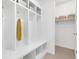 Bright mudroom features built-in storage, hooks, bench, and cubbies at 800 Meadowlark Dr, Erie, CO 80516