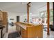 Open concept kitchen with breakfast bar, granite countertops, and access to an inviting living room at 11220 S Deer Creek Rd, Littleton, CO 80127