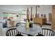 Open concept kitchen and living room area with large windows and bright interiors at 11220 S Deer Creek Rd, Littleton, CO 80127