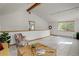Bright living room with vaulted ceilings, lots of windows, and tile flooring at 11220 S Deer Creek Rd, Littleton, CO 80127