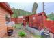 Backyard featuring sheds and raised garden beds at 11220 S Deer Creek Rd, Littleton, CO 80127