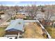 Aerial view showing backyard, storage shed, pergola, and neighborhood landscape at 6671 Chase St, Arvada, CO 80003
