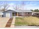 Charming brick home with a well-maintained front yard and an inviting entrance at 6671 Chase St, Arvada, CO 80003